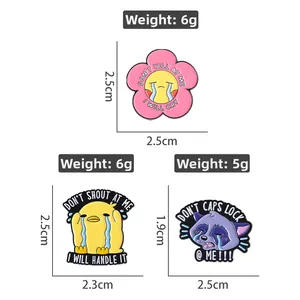 Detailed size and weight specs for enamel pins featuring cartoon duck and raccoon designs