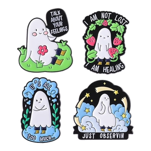 Set of four ghost enamel pins with healing quotes and cute cartoon illustrations
