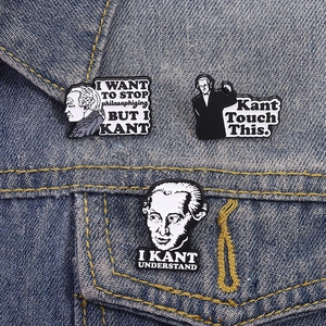 Detailed close-up of Immanuel Kant enamel pins with puns on dark blue denim jacket