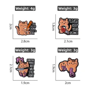 Detail view of four unique cartoon cat enamel pins with knives and chainsaws