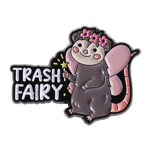 Cute cartoon opossum enamel pin with pink wings and Trash Fairy text on white background