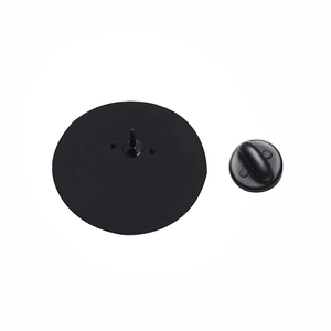 Macro detail of the matte black medical brooch back with metal pin and rubber clutch