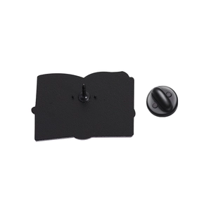 Detailed back view of book enamel pin with a black rubber clutch and sturdy metal needle