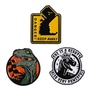Three creative dinosaur enamel pins set with danger signs and slogan on white background