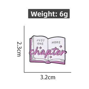 Detail view of purple book enamel pin with Just One More Chapter text and dimensions