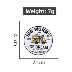 Detail view of round enamel ice cream truck brooch with 2.5cm diameter and 7g weight