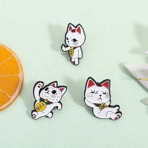 Set of three cartoon Maneki Neko cat enamel pins in white metal with gold coins