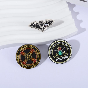 Russian Wagner Group combat bat badges set in black and flag colors on white stand