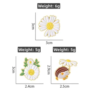 White daisy and cute hedgehog enamel pin set with gold trim for creative garment styling