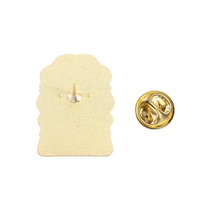 Close-up of golden metal butterfly clutch back and pin for Russian emblem badge