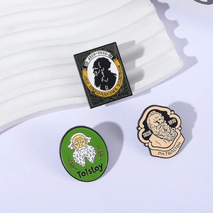 Set of three Leo Tolstoy enamel lapel pins with celebrity portraits in green and beige