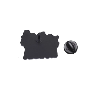 Detail view of the black enamel brooch back with a secure black rubber clutch fastener