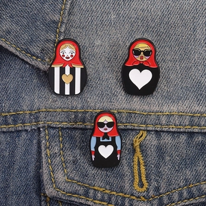 Set of three Russian Matryoshka doll enamel pins featuring modern sunglasses and heart designs