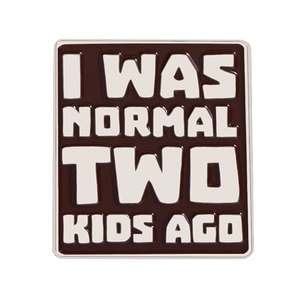 Brown enamel pin badge featuring humorous I WAS NORMAL TWO KIDS AGO quote for mothers