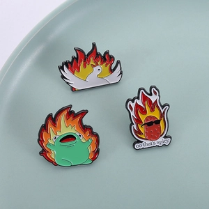Cartoon enamel pin set with flaming goose, spicy frog and strawberry designs