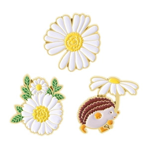 Three-piece enamel pin set featuring daisy flowers and a cute hedgehog with gold plating