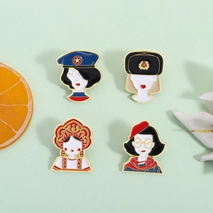 Set of four colorful Russian style enamel brooches featuring various ethnic female designs