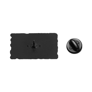 Detail view of the black metal badge back side with a durable rubber pin clutch