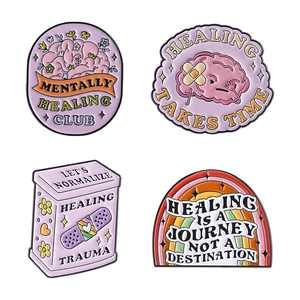 Pink mental health enamel pin set with brain, rainbow, and bandage creative designs