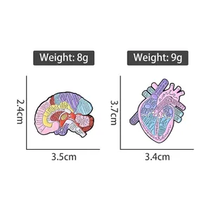 Colorful enamel pins featuring anatomical brain and heart designs with medical terms