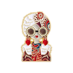 Detail view of retro Russian doll enamel brooch with heart earrings and vintage patterns
