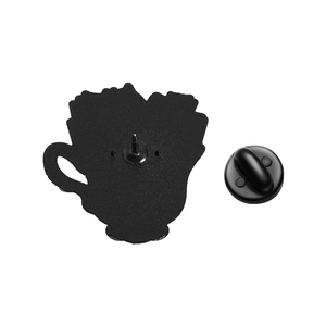 Detail view of the black enamel pin back with a secure black rubber clutch fastener