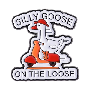 Funny enamel pin featuring a white goose riding an orange motorcycle with silly goose text