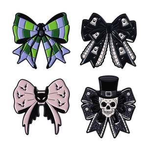 Gothic Halloween bow enamel pin set featuring skulls, spiders, bats, and ghost patterns