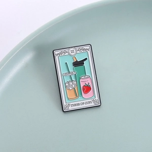 Three of Cups tarot enamel pin featuring pastel soda cans and cups on a ceramic plate