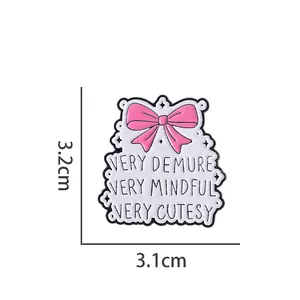 Pink bow enamel pin badge with Very Demure Very Mindful quote on a white background