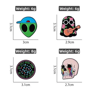Set of four cute enamel pins featuring cartoon ghost, alien, and pink skull metal badges