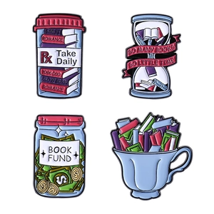 Set of 4 creative book lover enamel pins including hourglass and book fund designs