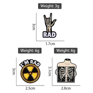 Three chemical radiation metal badges featuring skull fingers and I'M RAD cartoon designs