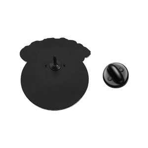 Close-up of black metal pin back and rubber clutch fastener for punk badges