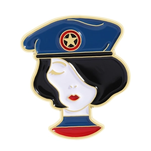 Retro Russian Matryoshka style enamel brooch with blue beret and gold star accent