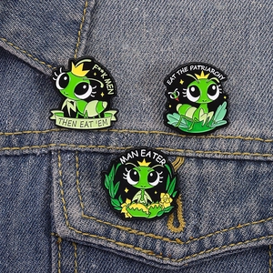 Cartoon green mantis enamel pin set with creative slogans on blue denim fabric