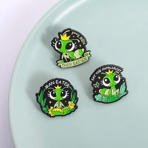 Cartoon mantis queen enamel pins set featuring female power slogans on a ceramic plate