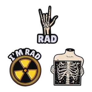 Three-piece enamel pin set with radioactive radiation sign and skeleton hand gesture