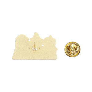 Detail of metal pin back with gold plating finish and secure butterfly clutch component