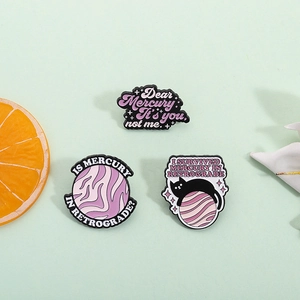 Three-piece purple cat and planet enamel pin set with retro celestial aesthetic