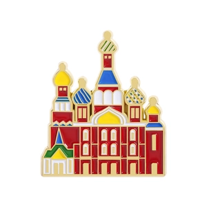 Detail of St. Basil's Cathedral enamel pin with colorful domes and gold-plated finish