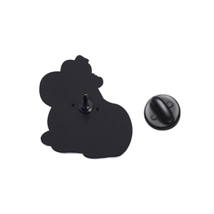 Detail of the black metal brooch back with sturdy rubber clutch and needle pin attachment