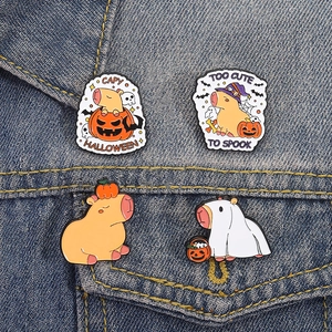 Halloween Capybara enamel pins set with pumpkin and wizard hat on denim jacket