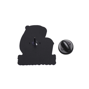 Detailed back view of a cute cartoon enamel pin with a black rubber clutch and metal pin