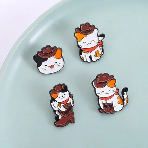 Creative cowboy cat enamel pins set featuring cartoon kittens in boots on a ceramic dish