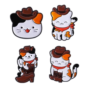 Set of four cute cowboy cat enamel pins with western hats and boots on white background