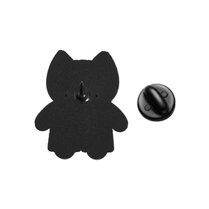 Close-up of the black rubber clutch and matte metal back of the white cat doctor brooch