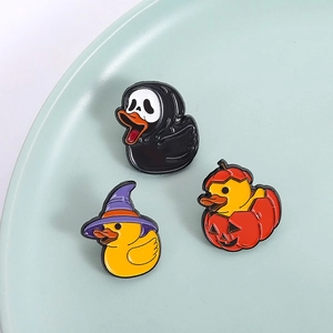 Three-piece Halloween duck enamel pin set featuring wizard hat and pumpkin design