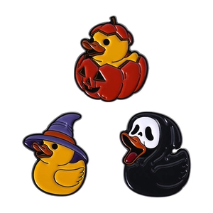 Set of three cute Halloween animal enamel pins featuring pumpkins and wizard ducklings