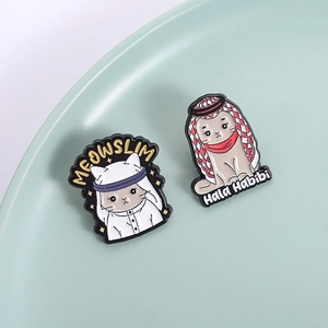 Cartoon enamel cat brooches set with Meowslim and Hala Habibi designs in Middle Eastern style
